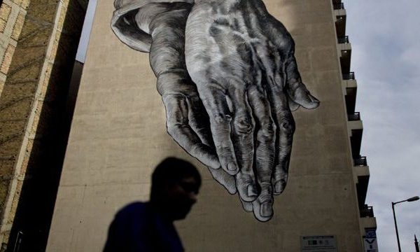 Graffiti artist iNo praying hands artwork